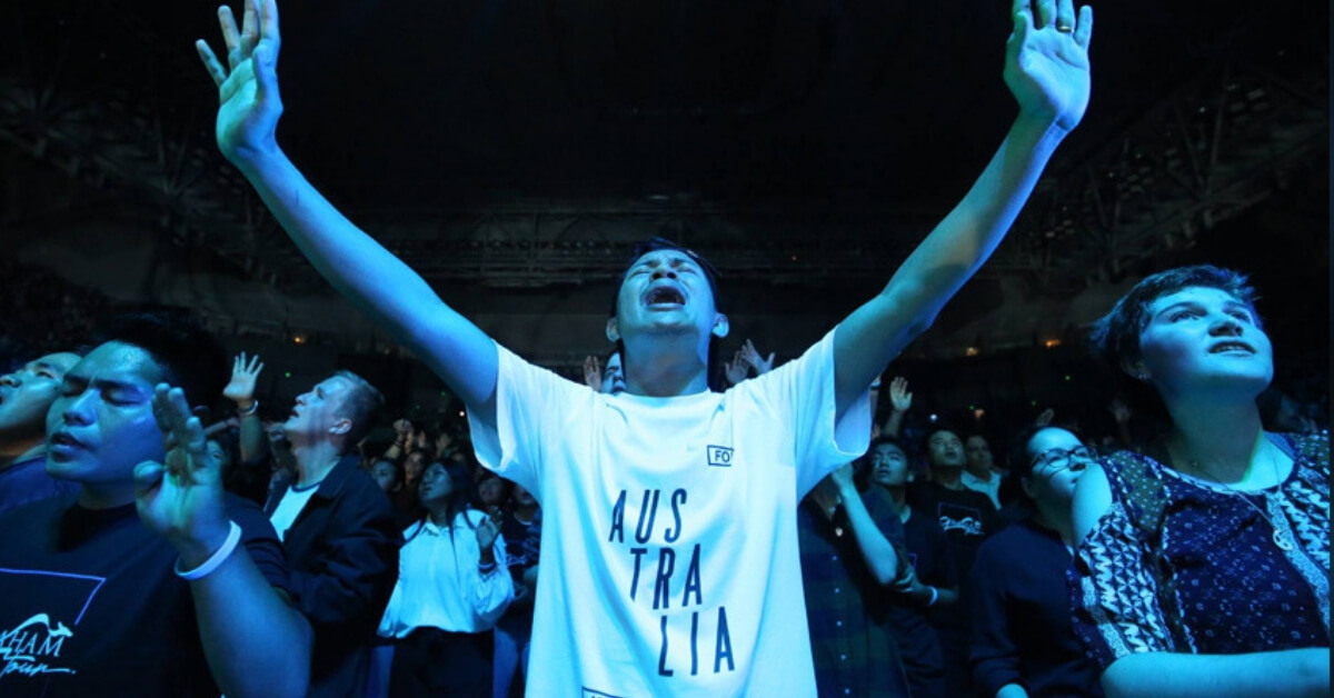 Young people pour out their hearts in worship and prayer at a packed Melbourne Arena on Saturday, February 16.