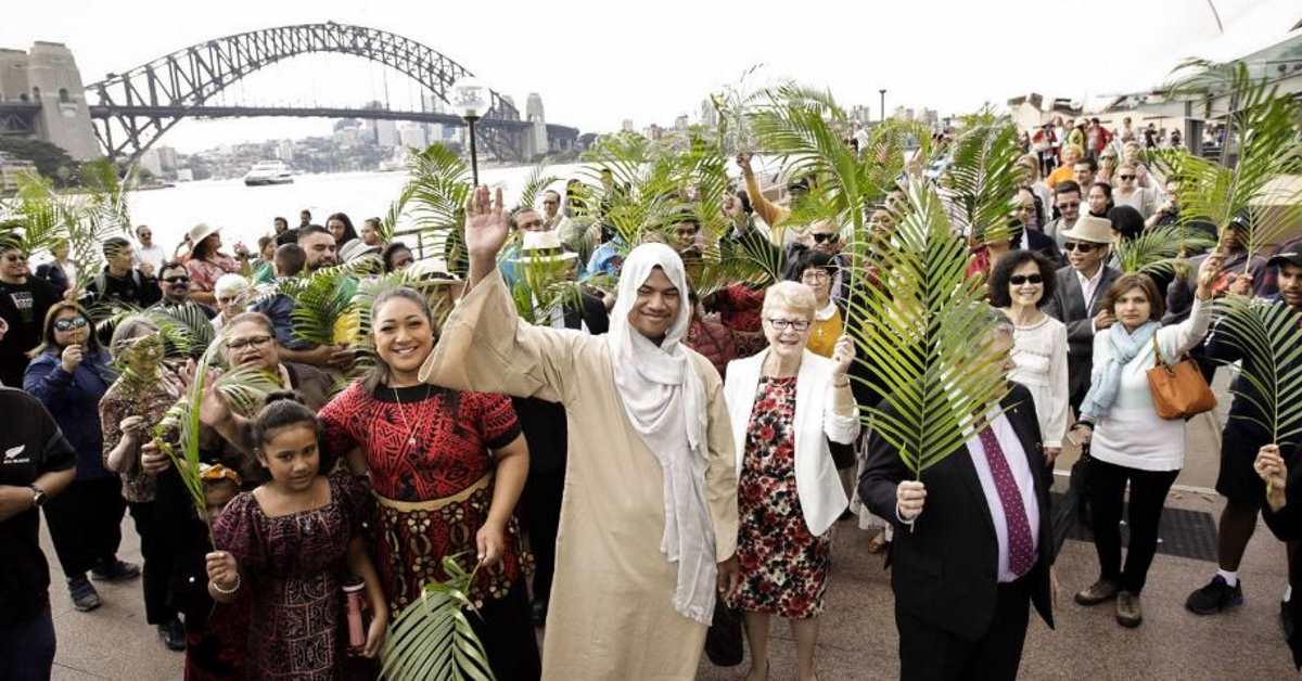 Members of Wesley Mission Church in Sydney – including William Lemalu dressed as Jesus – celebrate Palm Sunday in Circular Quay