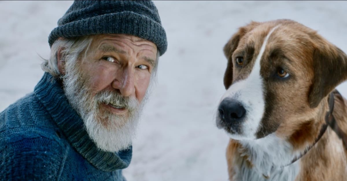 screen shot from film of Harrison Ford and dog in the snow