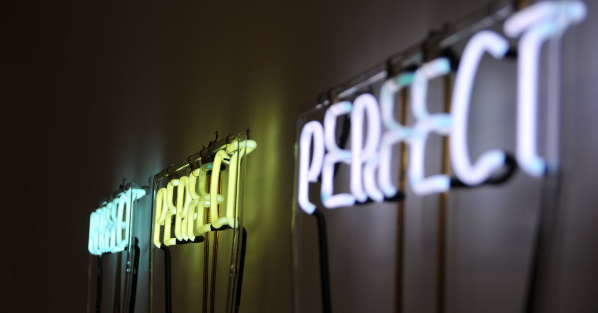 3 x neon signs of the word PERFECT