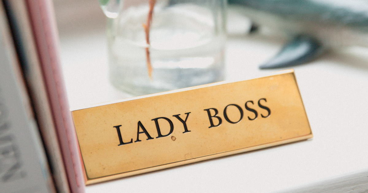 Desk with the name sign lady boss embossed in it