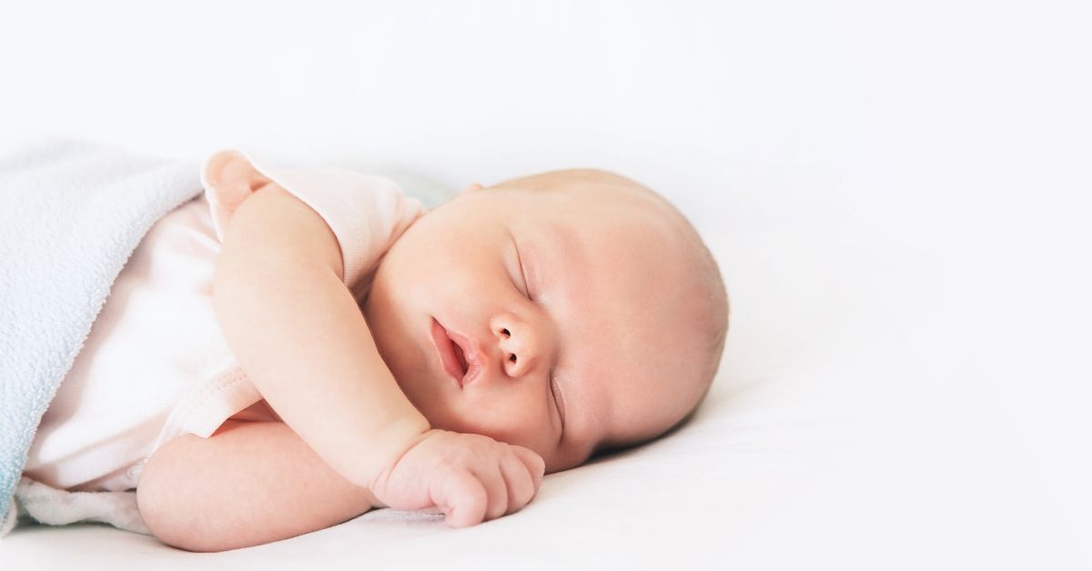 photo depicts a sleeping newborn