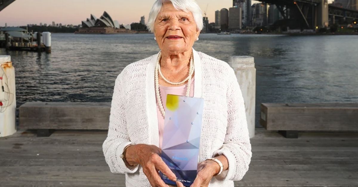 isabel reid with opera house and sydney harbour bridge behind her