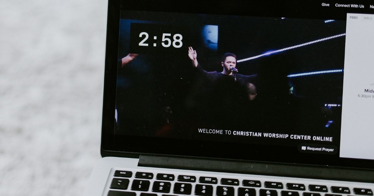 a worship service streaming on a laptop