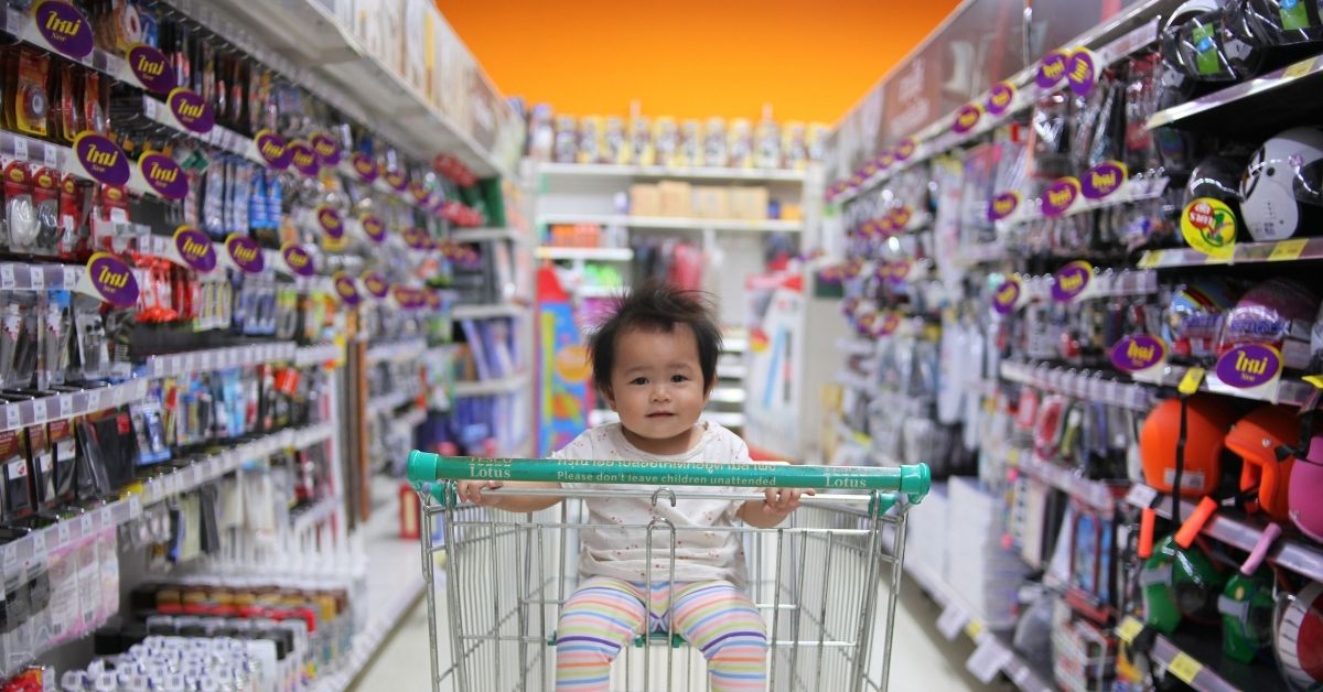 a child sits in a trolley