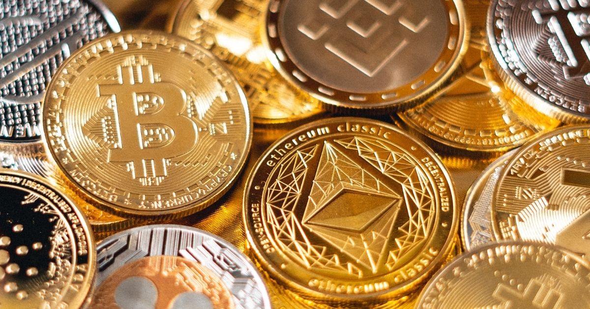 a pile of gold and silver coins representing different cryptocurrency