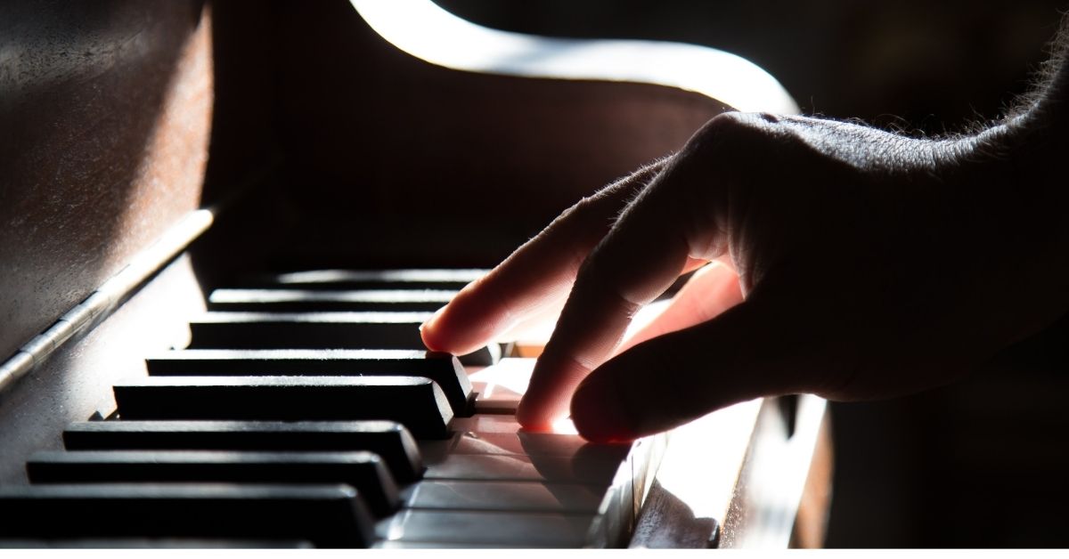 a person plays the piano