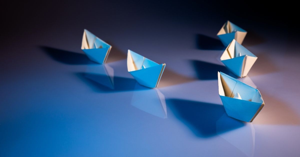 Paper boats in formation - Leadership - Unsplash