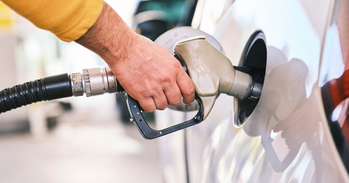 putting petrol in car -